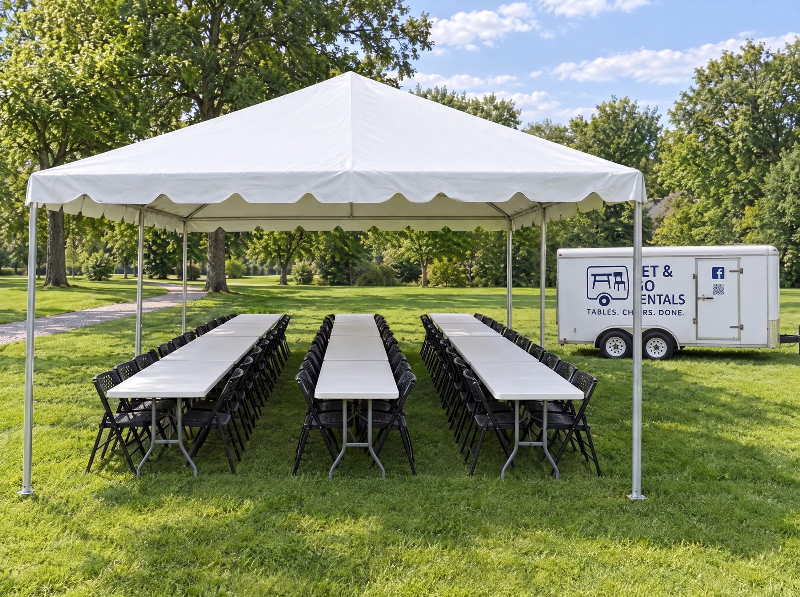 20x20 white frame tent over banquet tables and chairs on a lawn, Set & Go Rentals trailer beside it